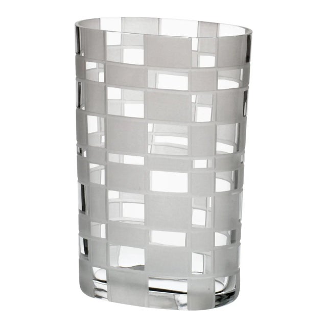 Oval free hand shaped vase in transparent Murano glass with detailed hand cut irregular chequered opaque squares designed...