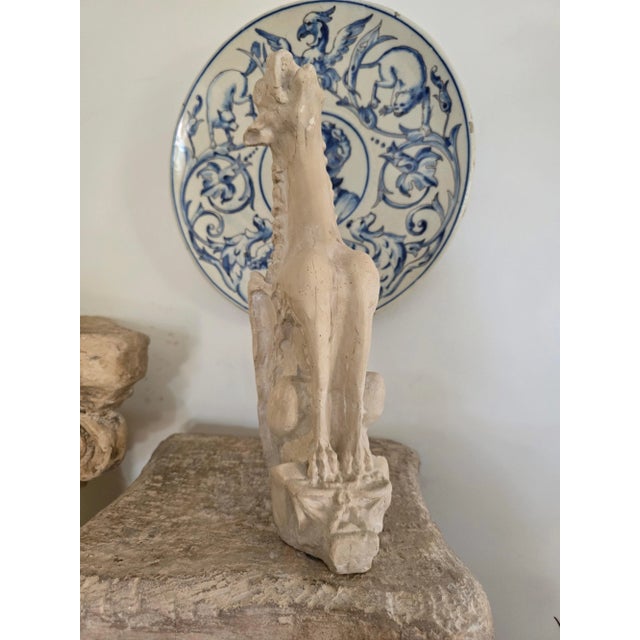 This charming small gargoyle, crafted from terracotta or a similar material in the 1950s, adds a whimsical touch to any...