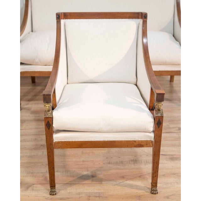 A sophisticated Swedish salon suite from the second half of the 19th century, comprising a sofa and a matching pair of...