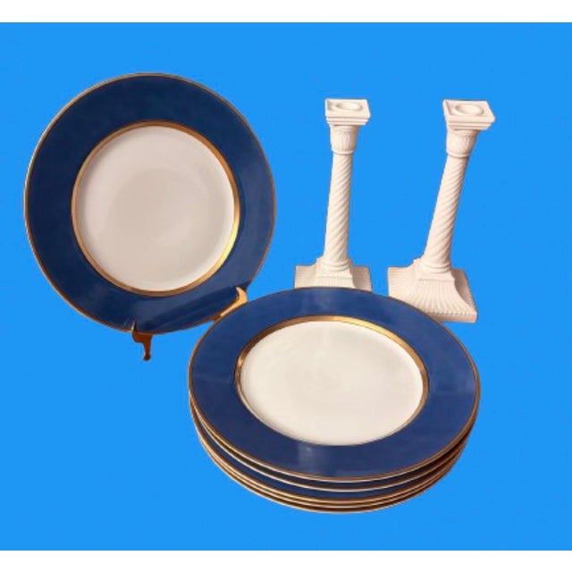 Vintage Fitz and Floyd Porcelain Candlesticks featuring an elegant twisted column stem and a stepped square base.A classic...