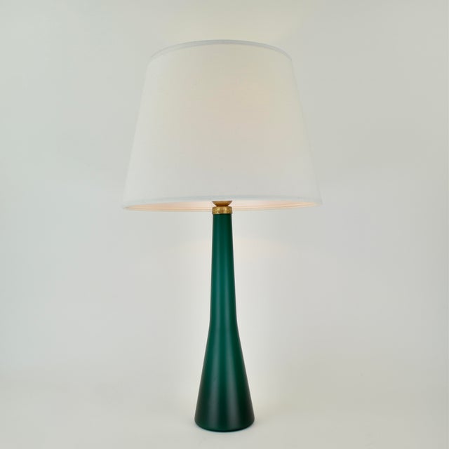 Stunning emerald green glass table lamp. Made around the 1960s, likely in Murano Italy, but the light is not marked. The...
