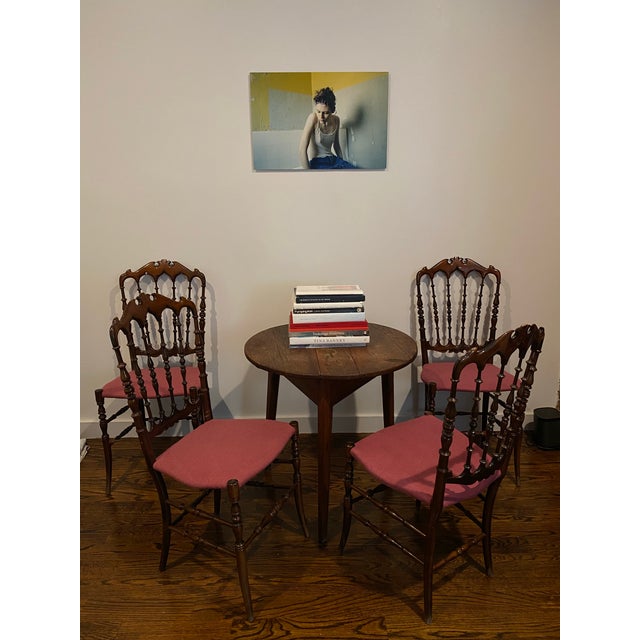 4 mid-century Italian Chiavari chairs designed by Giuseppe Gaetano Descalzi. Lightweight wood base with upholstered seats,...