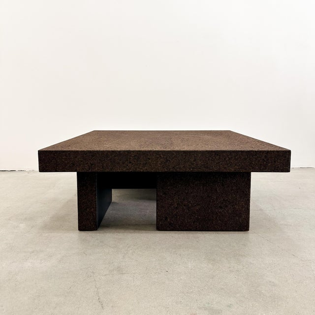A striking MCM 1970s cork coffee table featuring a clean square silhouette and a newly applied chocolate cork veneer. This...
