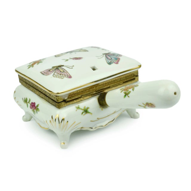 Metal Mid 20th Century Porcelain Footed Hinged Door Jewelry Trinket Box With Hand Painted Floral Butterfly Gold Trimmed Design and Handle For Sale - Image 7 of 11