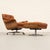 Luxurious lounge chair with matching ottoman, designed by Martin Stoll for Giroflex in the 1970s. Warmly grained wooden...
