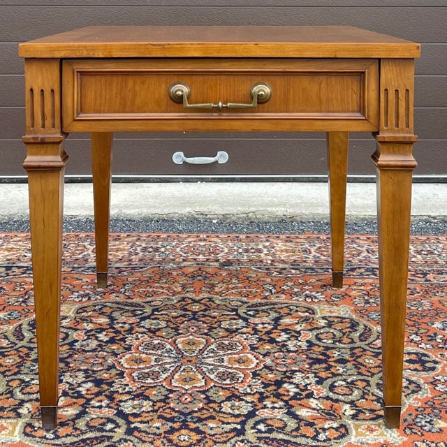 A vintage Century Furniture Traditional Regency style side table having a banded walnut veneered top and one dovetailed...