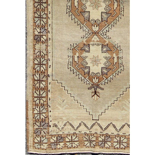 Measures: 4'1 x 9'5. Vintage Turkish Oushak Rug with Soft Beige Field and Warm Brown Medallions. Keivan Woven Arts /...