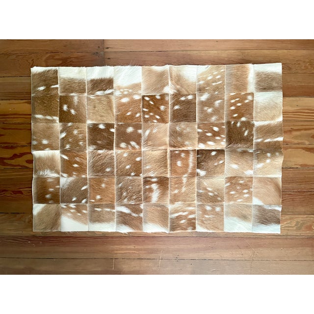 This decorative patchwork of axis deer hide remnants can be used for a multitude of decorative purposes, including as a...