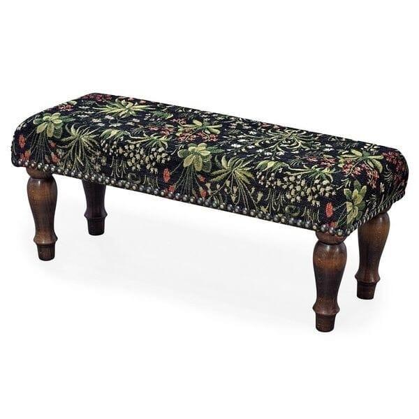 Meticulously handcrafted in the United Kingdom, this upholstered stool boasts classic studding and hand-polished solid...