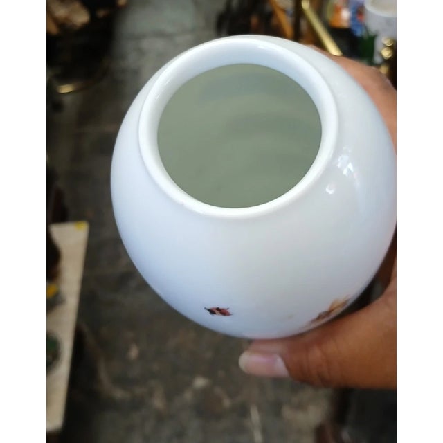 Bring timeless elegance to your home with this **Vintage Tiffany & Co. "Tiffany Summer" Ceramic Vase**, beautifully...