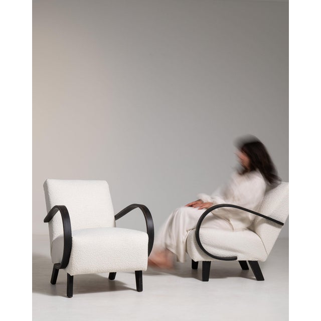 This piece presents as a dining chair, distinguished by cream boucle upholstery. Originating in France during 1950s, it...