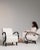 This piece presents as a dining chair, distinguished by cream boucle upholstery. Originating in France during 1950s, it...
