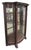 Spanish Revival dark toned cabinet with curving glass panels. This features fantastic carved details starting from the...