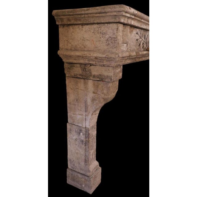 This rustic French fireplace mantel, carved from limestone in the early 20th century, embodies understated elegance and...