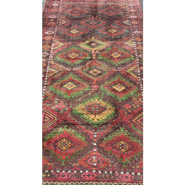 Antique Baluch tribal rug with all-over geometric in colorful design and motifs. Keivan Woven Arts, rug EMB-9680-P13558;...