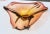 Murano splash bowl in a light bronze and golden yellow color. The organic triangular form with thick heavy glass walls. A...