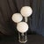 Doria table lamp, chrome-plated base and opal glass globes. This piece is attributed to the mentioned designer/maker. It...