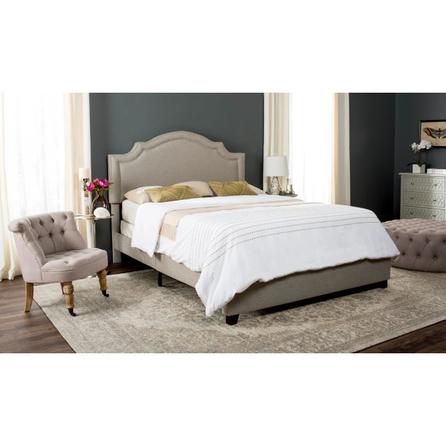 Upholstered from head to toe, this romantic bed speaks to modern elegance with refined lines and gracious curves. Its...