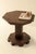 Geometrically shaped side table produced in Belgium around 1940. This octagonal Art deco table in dark stained wood...