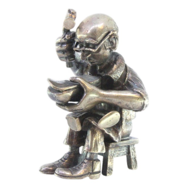Figure of Seated Shoemaker Repairing Shoes in Silver For Sale
