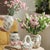 This hand-painted ceramic vase features an authentic crackle glaze finish with vintage farmhouse charm, perfect for...
