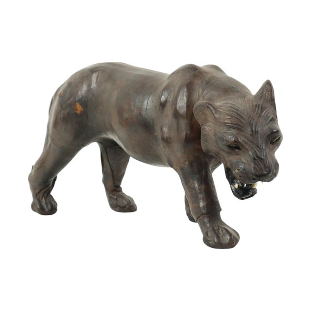 A beautiful and rare mid-century panther figure made of papier-mâché, stuffed with straw and covered in black leather,...