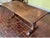A substantial oak refectory-style dining or library table with a solid plank top with rich, natural grain patterns,...
