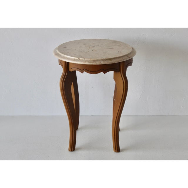 A gorgeous Italian marble-topped side table with carved wooden legs in a Queen Anne style. Classic mid-century design. The...