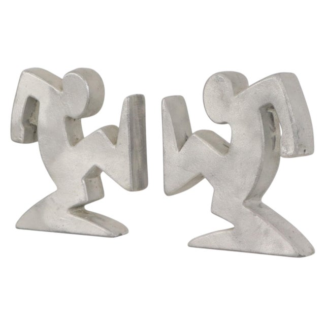 Cool vintage design bookends made of aluminum; the design is attributed to Osvaldo Cavandoli, the creator of the famous...