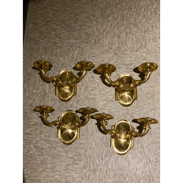 A pair of circa 1920’s gilt bronze Caldwell sconces with 2 lights