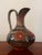 Vintage hand-painted and glazed folk art earthenware pitcher vase from the Tonala Jalisco region of Mexico.