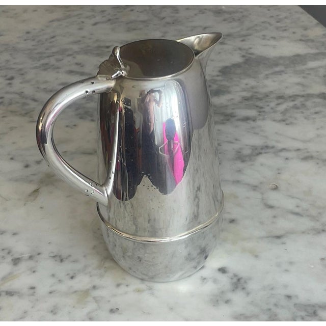 Built for high-performance service and enduring style, this vintage thermal pitcher is a masterclass in Streamline Moderne...