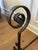 A handsome pair of antique 19th-century wrought iron andirons, showcasing the timeless craftsmanship of traditional...
