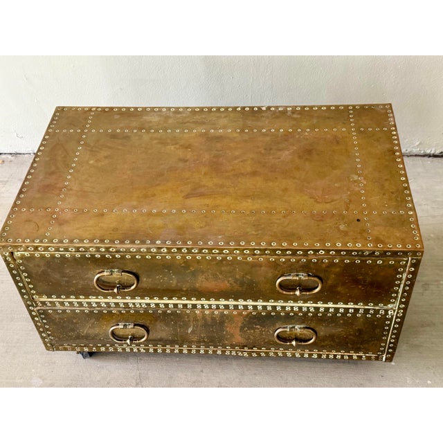 Nice vintage patina on this brass clad 2 drawer campaign chest attributed to Sarried limited. Attribution is based on...