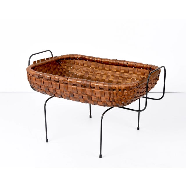 Unique mid-century chestnut wood, black metal and brass magazine basket. This amazing piece was made in Italy during the...