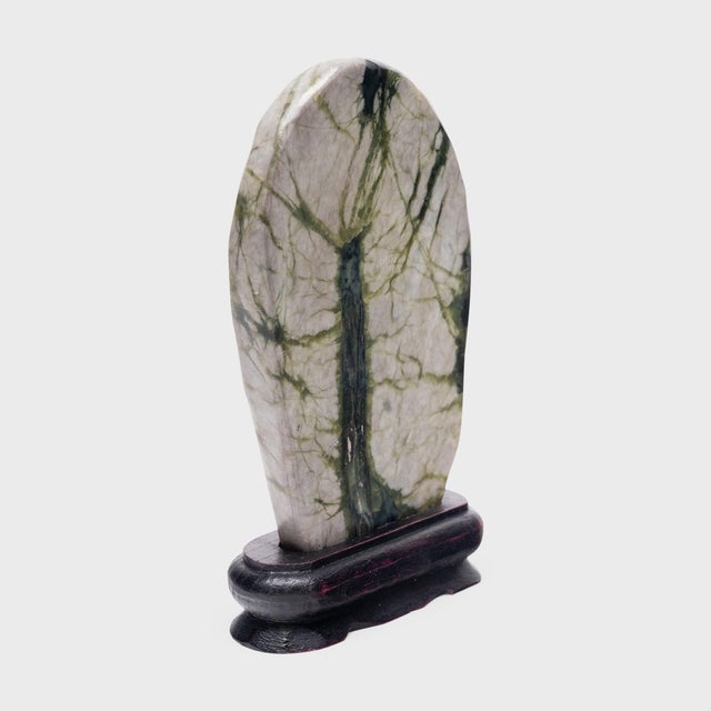 A well-chosen stone is a resting place for the mind, inspiring calm and contemplation. Marked by currents of jadeite, moss...