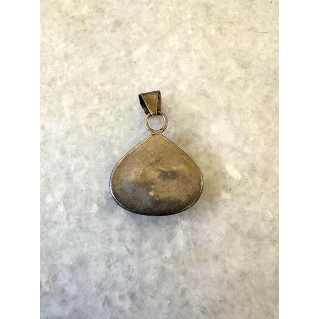 Handcrafted 925 sterling silver teardrop pendant featuring a deep blue lapis lazuli.