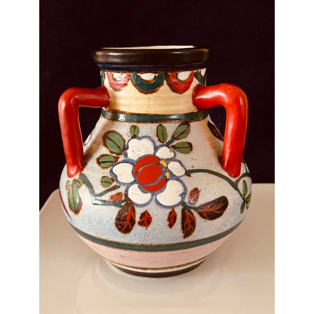 Offered for sale is this beautiful handmade, 3 handled, Etruscan shaped ceramic vase. This piece is vibrantly hand-painted...