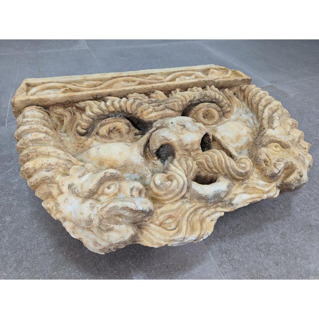 This impressive Neptune fountain head is a work of art carved in marble depicting the Roman god of the sea. The force in...