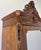 An impressive Antique French wardrobe in Walnut, showcasing rich burr figuring, a tall mirrored door and an elaborate...