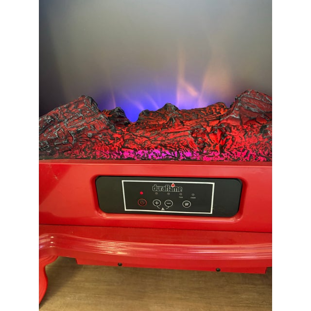 Vintage 2000s red petite metal electric fireplace with heater component and faux flames. Looks real and so cozy for...