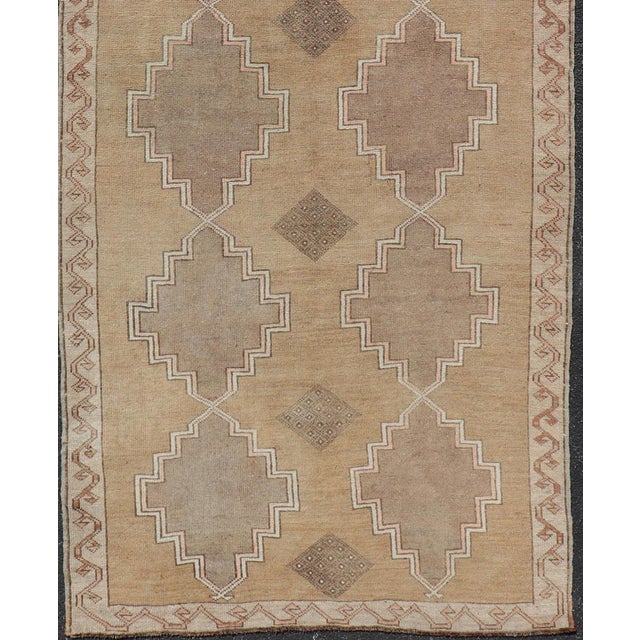Measures: 5'3 x 13'2 Vintage Turkish Kars Gallery Rug with Repeating Medallions in Taupe and Beige. Keivan Woven Arts /...