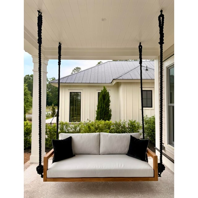Handcrafted teak swing bed designed for elevated outdoor living. The Bimini features a refined, open-frame silhouette that...