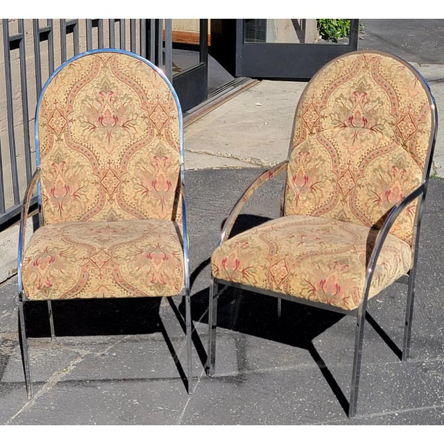 Set of eight Chrome armchairs. The fabric for these chairs are in good condition the chrome may need a little polish, the...