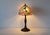 Tiffany inspired Art Nouveau dual bulb socket table lamp in a hummingbird and floral theme. Remarkable detail, quality...