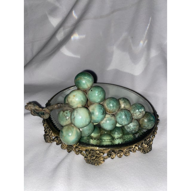 Decorative clusters resembling fruits, such as grapes, made from semi-precious stones have been popular as decorative...
