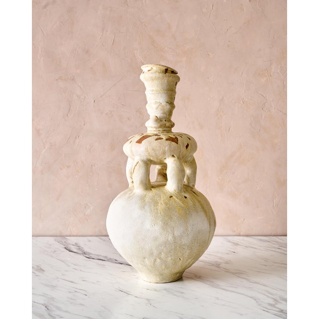 Gorgeous stoneware vase with a white and coffee glaze, this unique design is a perfect vessel for an off-beat overflowing...