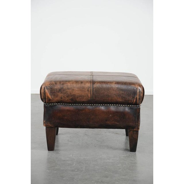 We are offering this elegant vintage sheepskin footstool with beautiful colors and amazing details. A sheepskin footstool,...