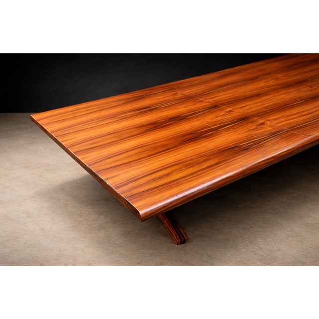 This sculptural dining table exemplifies the refined material intelligence and disciplined geometry that characterize...