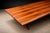 This sculptural dining table exemplifies the refined material intelligence and disciplined geometry that characterize...